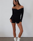 Knit romper. Long sleeves. Surplice neckline. Unlined. black romper. black off the shoulder romper. on the go cute outfit.