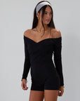 Knit romper. Long sleeves. Surplice neckline. Unlined. black romper. black off the shoulder romper. on the go cute outfit.