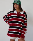 Striped knit top. Collar neckline. Front button closures. Long sleeves. Unlined. striped polo long sleeve. fall transition outfit.