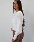 Knit cardigan. Long sleeves. Front button down closure. Banded hems. Unlined. white cardigan. fall transition outfit.