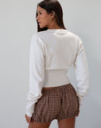 Plaid woven shorts. Elastic waist and leg openings. Unlined. 