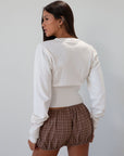 Knit cardigan. Long sleeves. Front button down closure. Banded hems. Unlined. white cardigan. fall transition outfit.