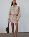 Denim skirt. Button and zipper fly. Four pocket construction. Unlined. tan denim skirt. fall outfit