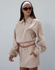 Denim skirt. Button and zipper fly. Four pocket construction. Unlined. tan denim skirt. fall outfit