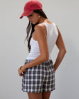 Plaid woven shorts. Elastic waistband. Faux button fly. Side pockets. Fully lined. plaid boxer shorts. black and white boxer shorts. fall outfit