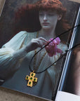 Green zircon 18k gold plated non-tarnish cross charm necklace. Adjustable rope necklace with lobster clasp. 
