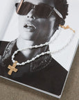 Beaded layered cross necklace. Adjustable lobster clasp closure.