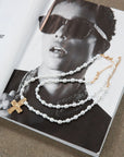 Beaded layered cross necklace. Adjustable lobster clasp closure.