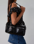 Vegan leather bag. Fixed top straps. Adjustable/detachable strap. Top zipper closure. Outer zipper pockets. Fully lined with inner zipper pocket.