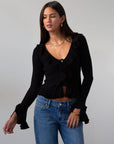 Crochet knit cropped sweater. Ruffle trim. Long sleeves. Front button down closures. Unlined. black sweater. black cardigan sweater. fall outfit