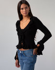 Crochet knit cropped sweater. Ruffle trim. Long sleeves. Front button down closures. Unlined. black sweater. black cardigan sweater. fall outfit