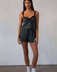 green Checkered woven cropped tank. Lace trim. Adjustable straps. Front tie. Elastic back. Partially lined. fall outfit