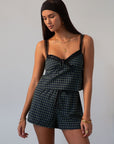green Checkered woven cropped tank. Lace trim. Adjustable straps. Front tie. Elastic back. Partially lined. fall outfit