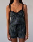 green Checkered woven shorts. Lace trim. Elastic waistband. Tie waist. Back pockets. Fully lined. fall outfit