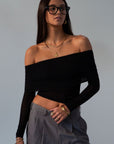 Knit top. Folded off the shoulder neckline. Long sleeves. Unlined/sheer. black off the shoulder long sleeve. fall outfit