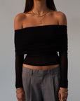 Knit top. Folded off the shoulder neckline. Long sleeves. Unlined/sheer. black off the shoulder long sleeve. fall outfit