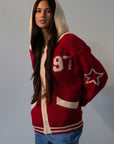 Fuzzy crochet knit sweater. Hoodie. Exposed front zipper closure. Front pockets. Unlined. red sweater. fall outfit. red zip up sweater