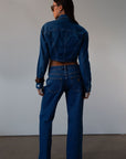 Straight leg jeans. Button and zipper fly. Five pocket construction. Unlined.