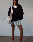Pleated knit skirt. Elastic waistband. Shorts lining. white skirt. tennis skirt. fashion tennis skirt. preppy skirt. preppy outfit. fall outfit