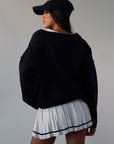 Pleated knit skirt. Elastic waistband. Shorts lining. white skirt. tennis skirt. fashion tennis skirt. preppy skirt. preppy outfit. fall outfit