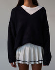 Pleated knit skirt. Elastic waistband. Shorts lining. white skirt. tennis skirt. fashion tennis skirt. preppy skirt. preppy outfit. fall outfit