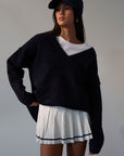 Pleated knit skirt. Elastic waistband. Shorts lining. white skirt. tennis skirt. fashion tennis skirt. preppy skirt. preppy outfit. fall outfit