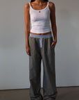Plaid woven pants. Elastic waistband. Faux button fly. Side pockets. Fully lined. lounge pants. boxer pants