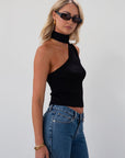 Ribbed knit cropped tank. Asymmetric neckline with adjustable halter tie. Unlined. black tank. fall outfit. fall top. going out top
