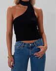 Ribbed knit cropped tank. Asymmetric neckline with adjustable halter tie. Unlined. black tank. fall outfit. fall top. going out top