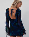 Printed chiffon dress. Long sleeves with tie closures. Ruffle trim. Front and back tie closures. Side zipper closure. Fully lined. mini dress. blue and green mini dress. fall outfit