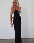 Polka dot satin maxi dress. Adjustable straps. Front tie closure. Unlined. black and white polka dot maxi dress. fall transition dress. black maxi dress
