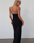 Polka dot satin maxi dress. Adjustable straps. Front tie closure. Unlined. black and white polka dot maxi dress. fall transition dress. black maxi dress