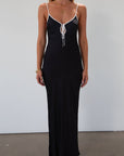 Polka dot satin maxi dress. Adjustable straps. Front tie closure. Unlined. black and white polka dot maxi dress. fall transition dress. black maxi dress