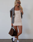 Seamed denim dress. Adjustable straps. Back zipper closure. Fully lined. cream mini dress. fall outfit