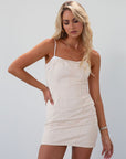 Seamed denim dress. Adjustable straps. Back zipper closure. Fully lined. cream mini dress. fall outfit