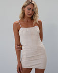 Seamed denim dress. Adjustable straps. Back zipper closure. Fully lined. cream mini dress. fall outfit