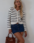 Striped crochet knit cropped cardigan. Front button down closure. Faux front pockets. Unlined. fall outfit. fall top. striped cardigan
