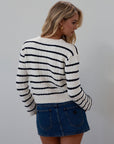 Striped crochet knit cropped cardigan. Front button down closure. Faux front pockets. Unlined. fall outfit. fall top. striped cardigan