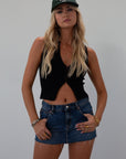Ribbed knit sleeveless top. V-neckline. Front hook and eye closures. black top. going out top.
