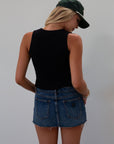 Ribbed knit sleeveless top. V-neckline. Front hook and eye closures. black top. going out top.