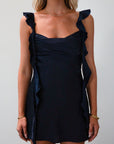 Satin dress. Adjustable straps with ruffle trim. Side hook and eye and zipper closures. Elastic back strap with clasp closure. Fully lined. navy blue mini dress. holiday dress. mini holiday dress