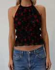 Floral printed chiffon crop top. Adjustable halter neckline with tie closure. Adjustable back tie closures. Fully lined. rose shirt. going out top. fall top. fall going out top. fall outfit