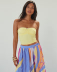 Knit tube top. Elastic neckline. Flower detail. Ruched front. Unlined. yellow tube top. summer top.