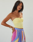 Knit tube top. Elastic neckline. Flower detail. Ruched front. Unlined. yellow tube top. summer top.
