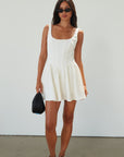 Woven sleeveless dress. Boning in bodice. Back hook and eye closures. Fully lined. off white mini dress. white mini dress. cream mini dress. bridal shower dress. bridal dress