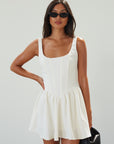 Woven sleeveless dress. Boning in bodice. Back hook and eye closures. Fully lined. off white mini dress. white mini dress. cream mini dress. bridal shower dress. bridal dress
