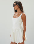 Woven sleeveless dress. Boning in bodice. Back hook and eye closures. Fully lined. off white mini dress. white mini dress. cream mini dress. bridal shower dress. bridal dress