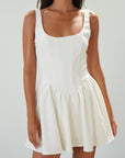 Woven sleeveless dress. Boning in bodice. Back hook and eye closures. Fully lined. off white mini dress. white mini dress. cream mini dress. bridal shower dress. bridal dress