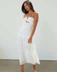 Woven midi dress. Halter tie neckline. Front v-wire. Front cut outs. Ruched bodice. Back hook and eye and zipper closures. Fully lined. Bride. Bridal dress. Engagement dress. Bridal shower dress. summer dress. white midi dress. white halter neck dress