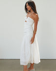 Woven midi dress. Halter tie neckline. Front v-wire. Front cut outs. Ruched bodice. Back hook and eye and zipper closures. Fully lined. Bride. Bridal dress. Engagement dress. Bridal shower dress. summer dress. white midi dress. white halter neck dress